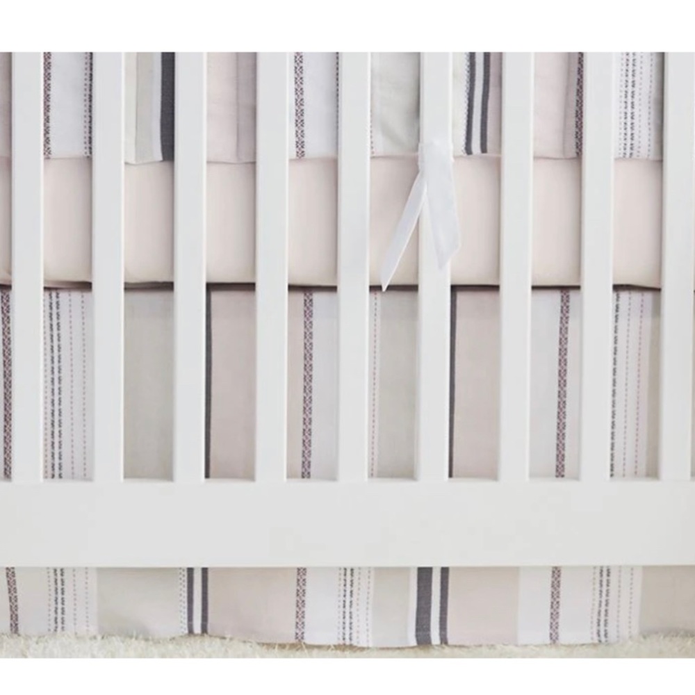 Coyuchi Sunset Stripe Crib Skirt Warm Pink Organic